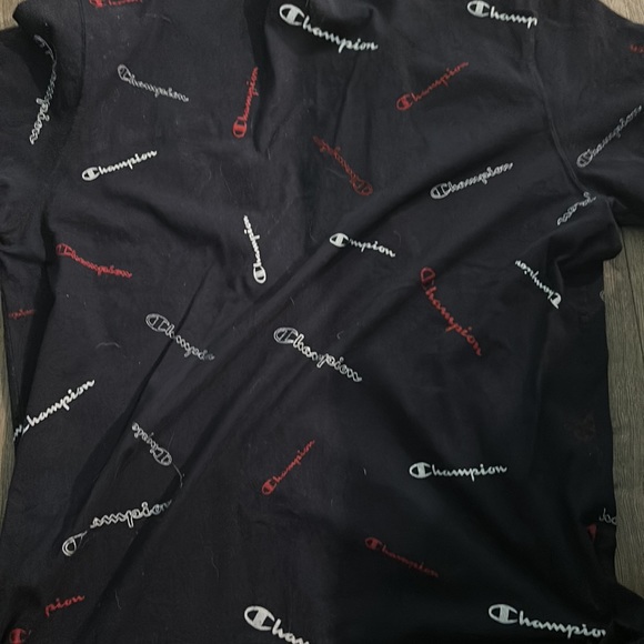 Black Champions tee shirt with the work champion written on the shirt - Picture 2 of 2